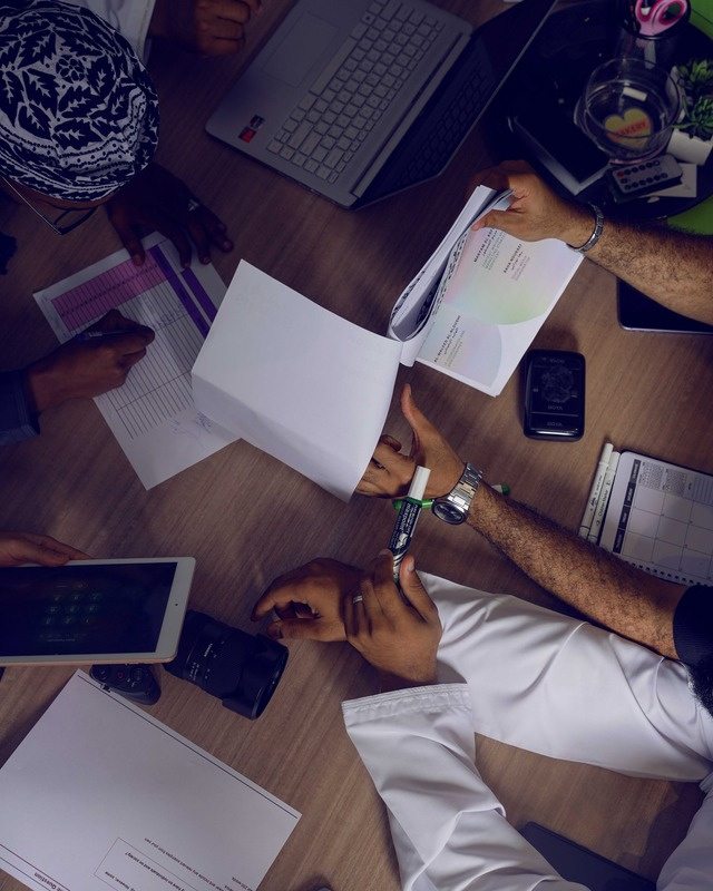 Overhead view of the Limitless Power team planning a campaign