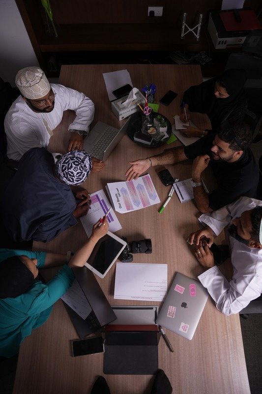 The Limitless Power team working together around a table