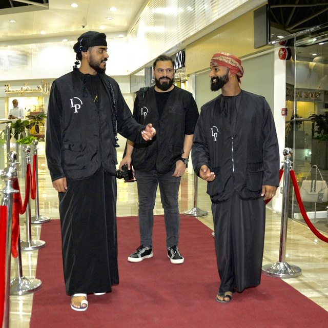 Guests arriving on the red carpet at an exhibition opening run by Limitless Power